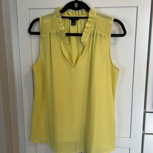 Yellow sleeveless blouse